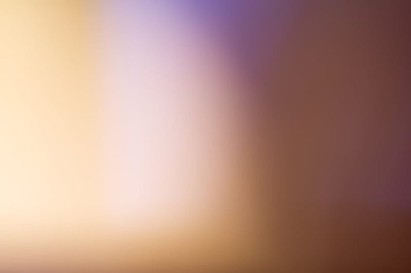 A soothing abstract blurred gradient background with warm tones.